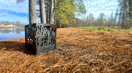 Portable Fire Pit set up in the woods by a river