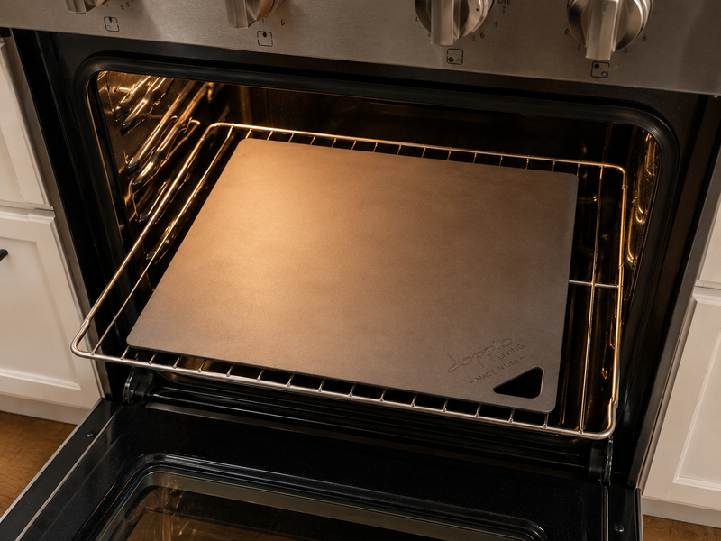  Doppio Living pizza steel sitting on an oven rack with even clearance on each side.