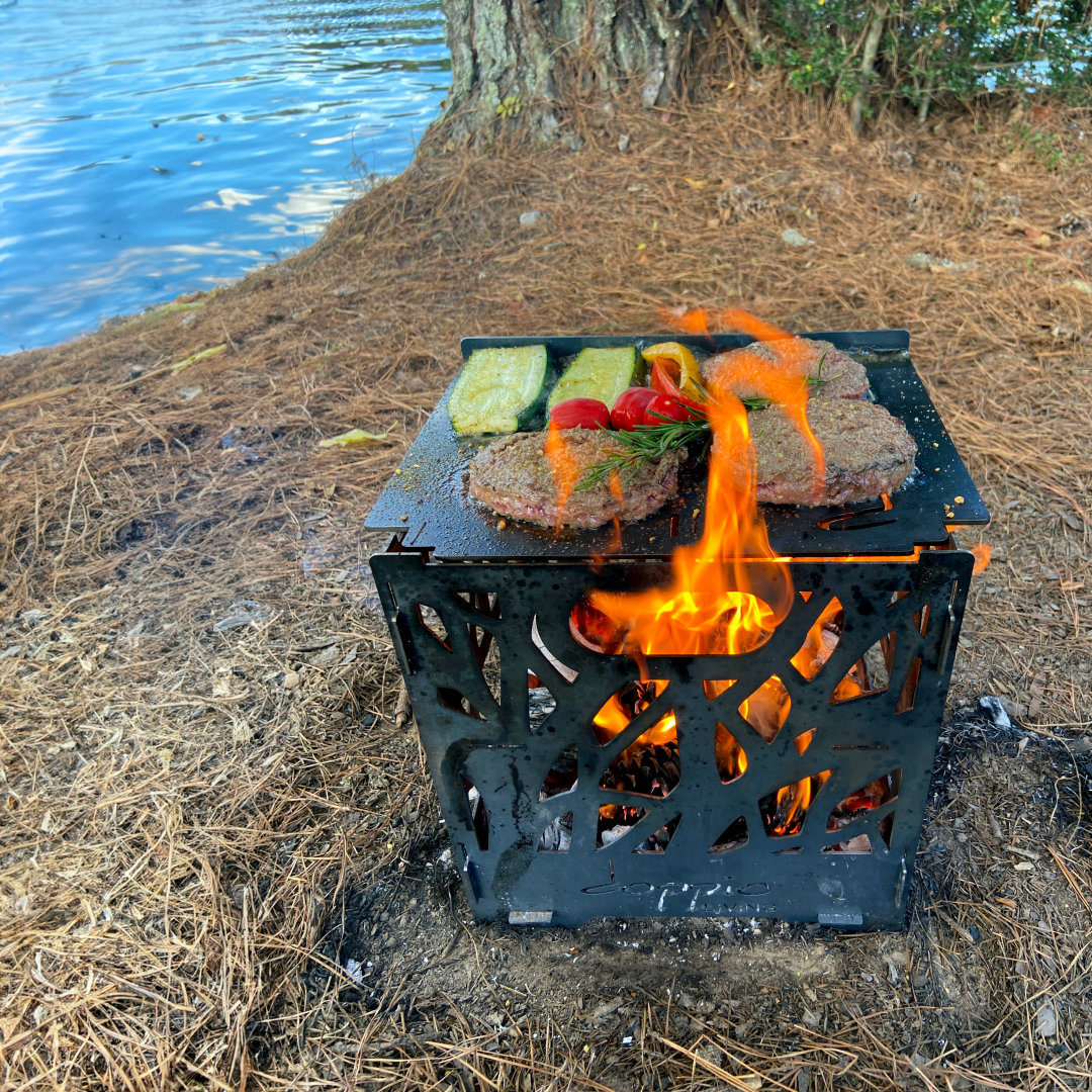 Fire Pit Grill Cooking on a flat top skillet