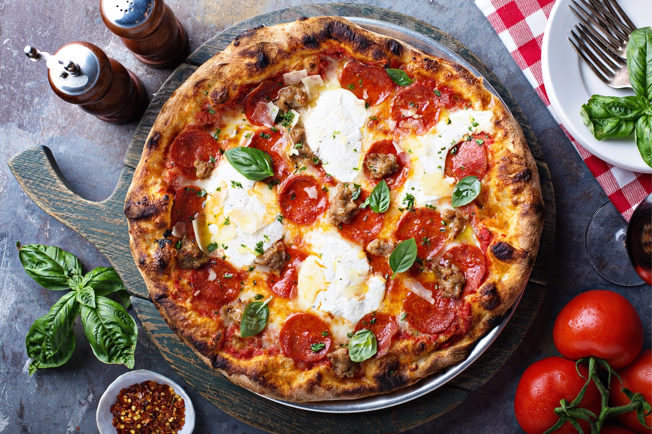 Pepperoni and Mozzarella pizza topped with fresh basil.