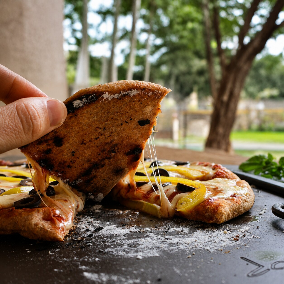 Showing the perfectly charred undersize of a pizza